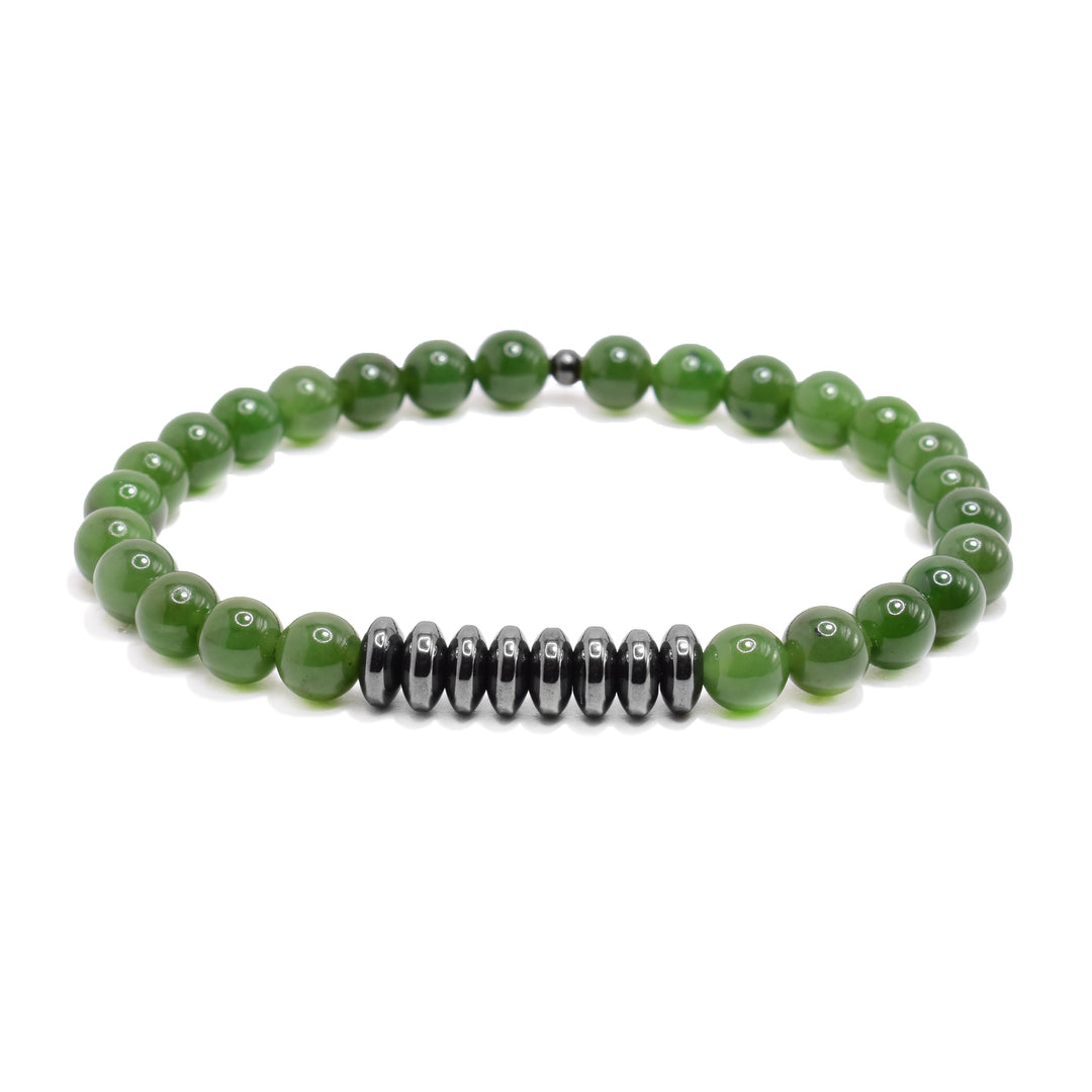 This jade bead bracelet has small, sphere beads made form jade and there is a row of round, thin hematite beads.
