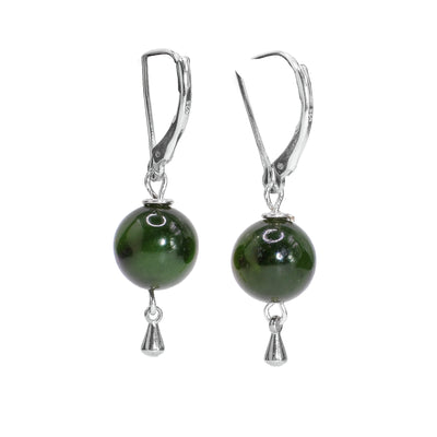 These dangling jade earrings have large, jade ball hangs and sterling silver hooks and charms dangling from the balls. Funky Drop Earrings.