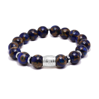 This sterling silver and jasper bracelet as sphere beads made from the gems and flat circle silver spacers. There is a spirit bead featured on the piece with a depiction of the Raven carved into it.