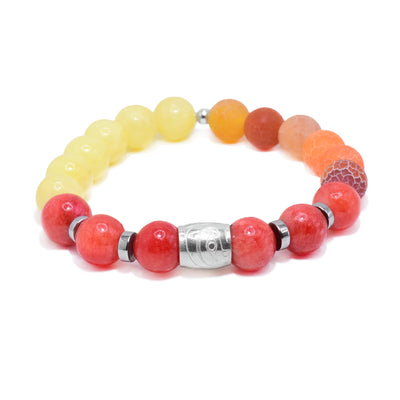 This sterling silver, quartz and agate bracelet as sphere beads made from the gems and flat circle silver spacers. There is a spirit bead featured on the piece with a depiction of the Hummingbird carved into it.