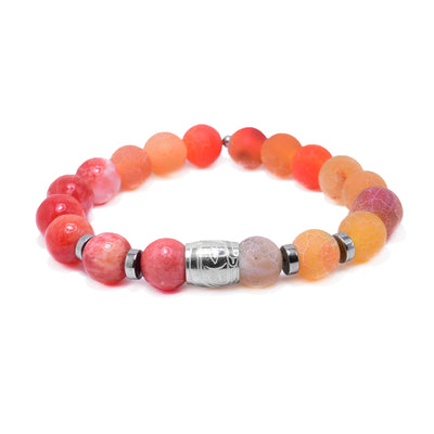 This sterling silver, quartz and agate bracelet as sphere beads made from the gems and flat circle silver spacers. There is a spirit bead featured on the piece with a depiction of the Raven carved into it.