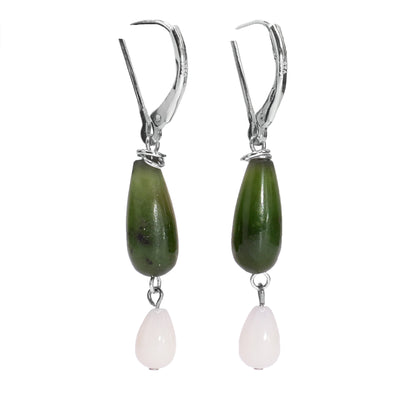 These long drop jade earrings have been made using genuine jade, pink coral and sterling silver. There are long jade hangs with pink coral charms dangling from the jade.