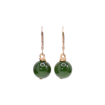 These BC jade earrings have large jade balls hanging from 14K gold filled wires and hooks.