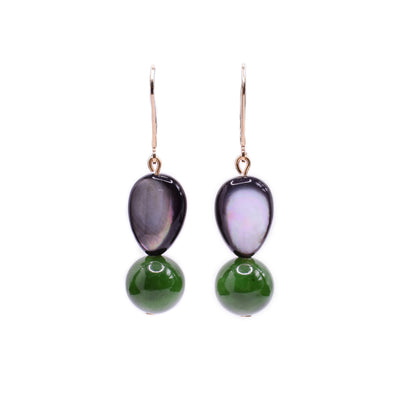 These dangling mother of pearl and BC jade earrings have 14K gold filled hooks. The mother of pearl is wide and teardrop shaped and the jade beads are smaller and spherical.