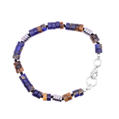 This beaded gemstone bracelet is made from gun metal, hematite, lapis lazuli, jasper and tigers eye. There are small, thin and circular beads made from all of the listed elements laced around the bracelet. 