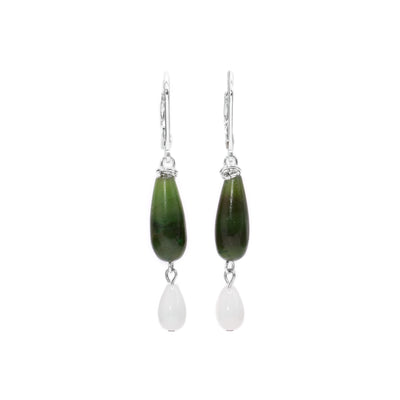 These BC jade earrings are long and teardrop shaped and have shorter, white teardrop coral hangs below them. The beads are linked together with sterling silver.