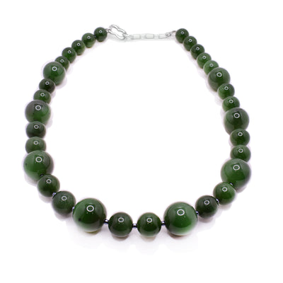 This BC jade necklace has various sized sphere beads. The jade beads are separated by small Miyuki glass beads. beads.