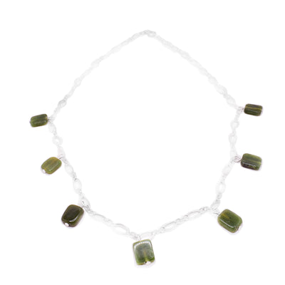 This BC jade necklace has seven rectangle BC jade charms on it and a sterling silver chain.