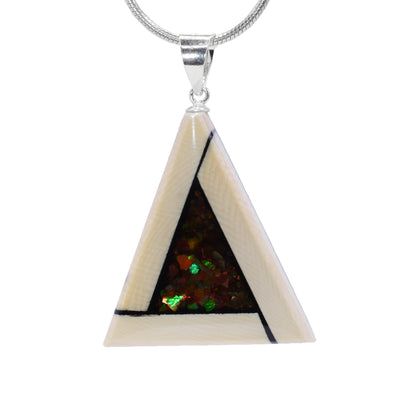 This triangle pendant is made using fossilized mammoth ivory and ammolite gemstones. The border of the piece is made from ivory and they is a smaller triangle made from ammolite in the center.