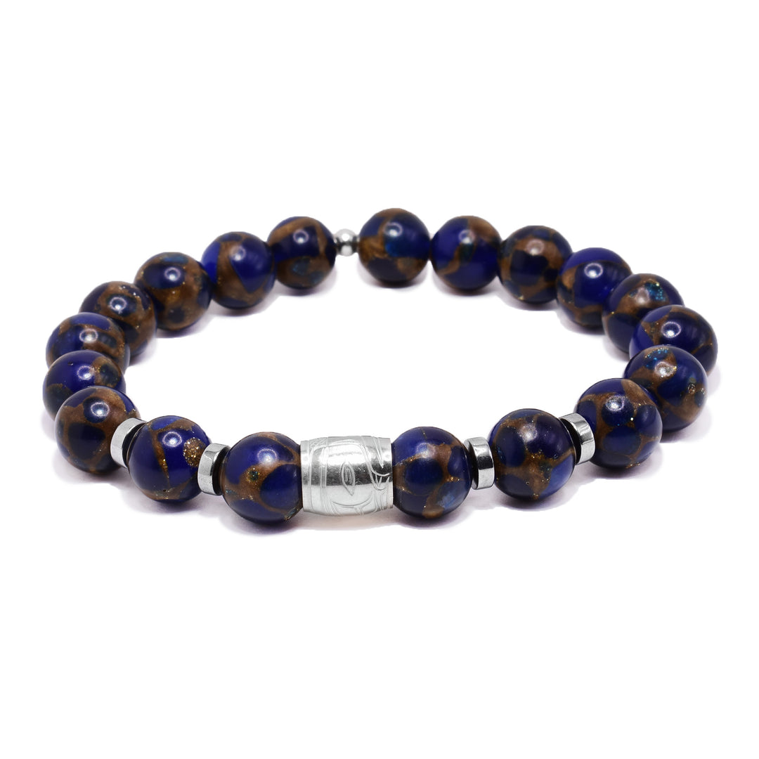 This sterling silver and sodalite gemstone bracelets has sphere beads made from the gems and flat circle hematite spacers. There is a spirit bead featured on the piece with a depiction of the Eagle carved into it.