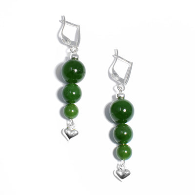 For each earring, there are three round BC jade beads stacked below the hook. Biggest to smallest from top to bottom. Small, silver puff heart adornment dangles off bottom.