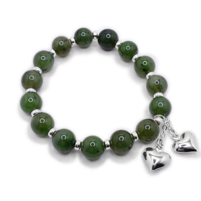 Round jade beads with smaller, cylindrical silver beads between. Two silver puff hearts dangle together from short chains. Sterling silver and BC jade.