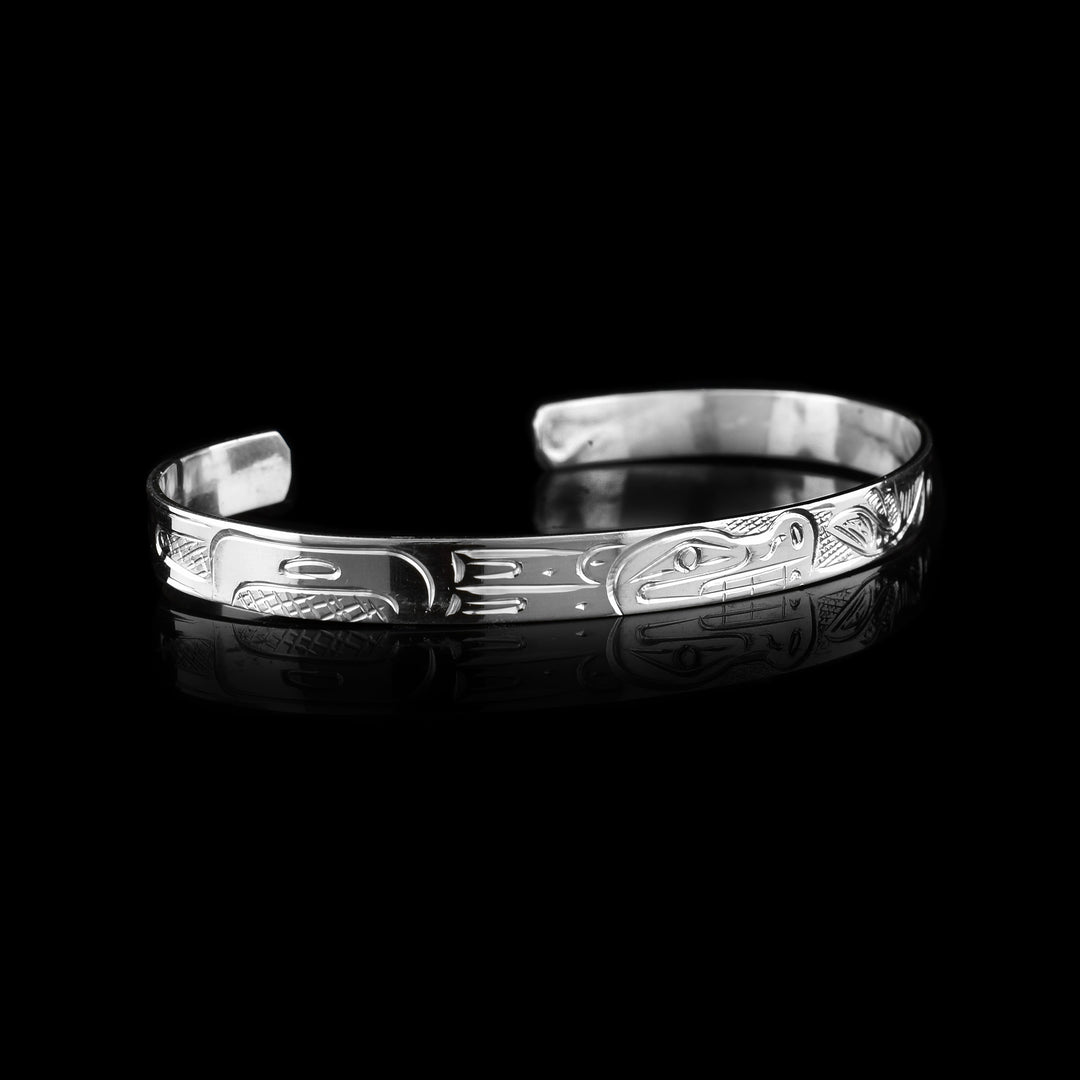 Bear and Salmon Cuff Bracelet - The sterling silver cuff is hand carved with the legend of the Bear and the Salmon on the bracelet. 