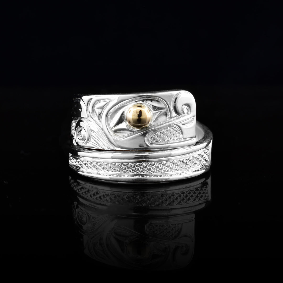 This wrap ring is made out of sterling silver and 14k gold. 