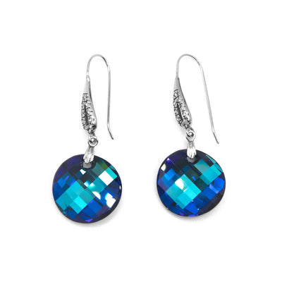 Round, curved Bermuda Blue colour Swarovski crystals dangle below hooks with texture and cubic zirconia. All metal is sterling silver.