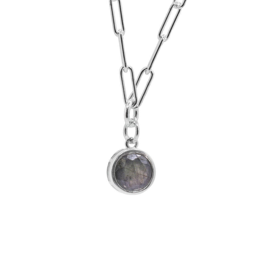 Beautifully designed by Elizabeth Burry. Elevate your style with this minimalist sterling silver bezel-set circular Labradorite gemstone pendant.