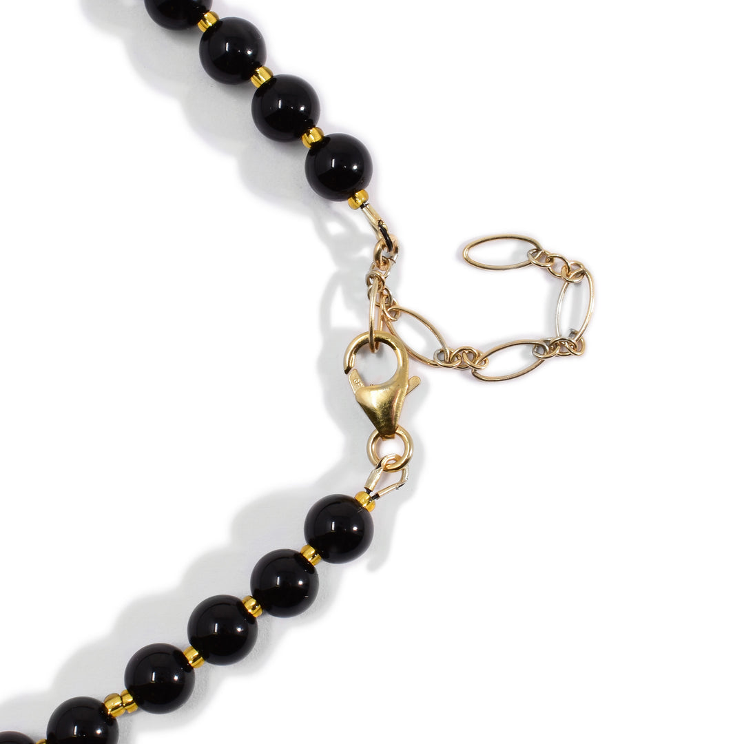 Image of back of necklace showing gold-fill extender.