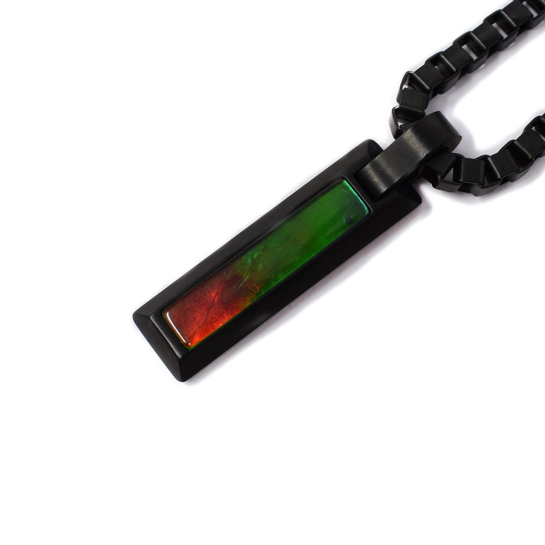 Pendant is skinny rectangle of black titanium with A grade ammolite stone. Chain is thick and masculine.