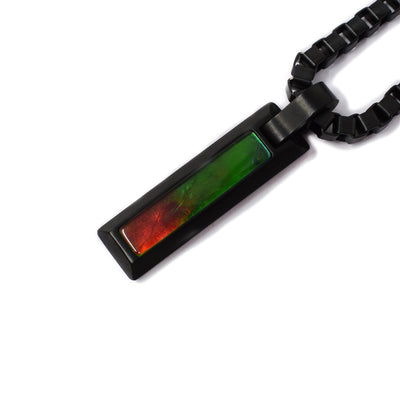 Pendant is skinny rectangle of black titanium with A grade ammolite stone. Chain is thick and masculine.