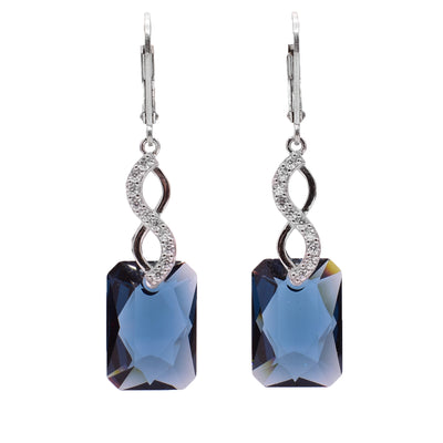 These Swarovski crystal earrings feature blue rectangular Swarovski crystals. The clips incorporates cubic zirconia in an infinity style.