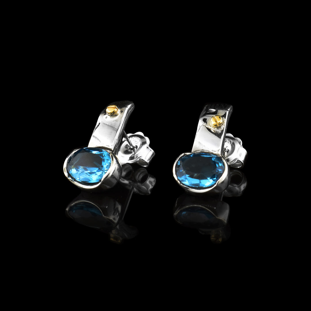 Blue Topaz Drop Earrings, With blue topaz bottoms the silver drops have accented gold. 