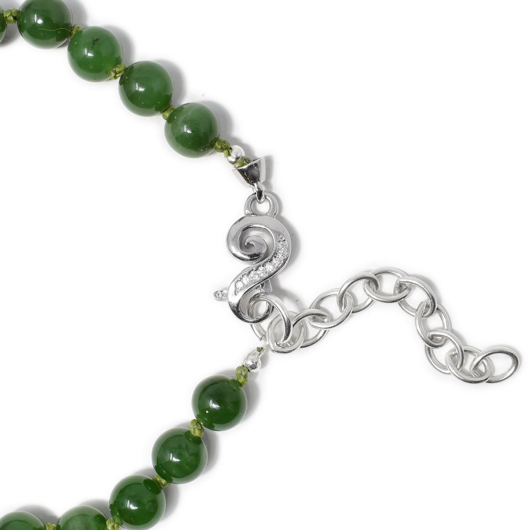 Sterling silver swirly s-shaped lobster clasp with cubic zirconia and chain extension.