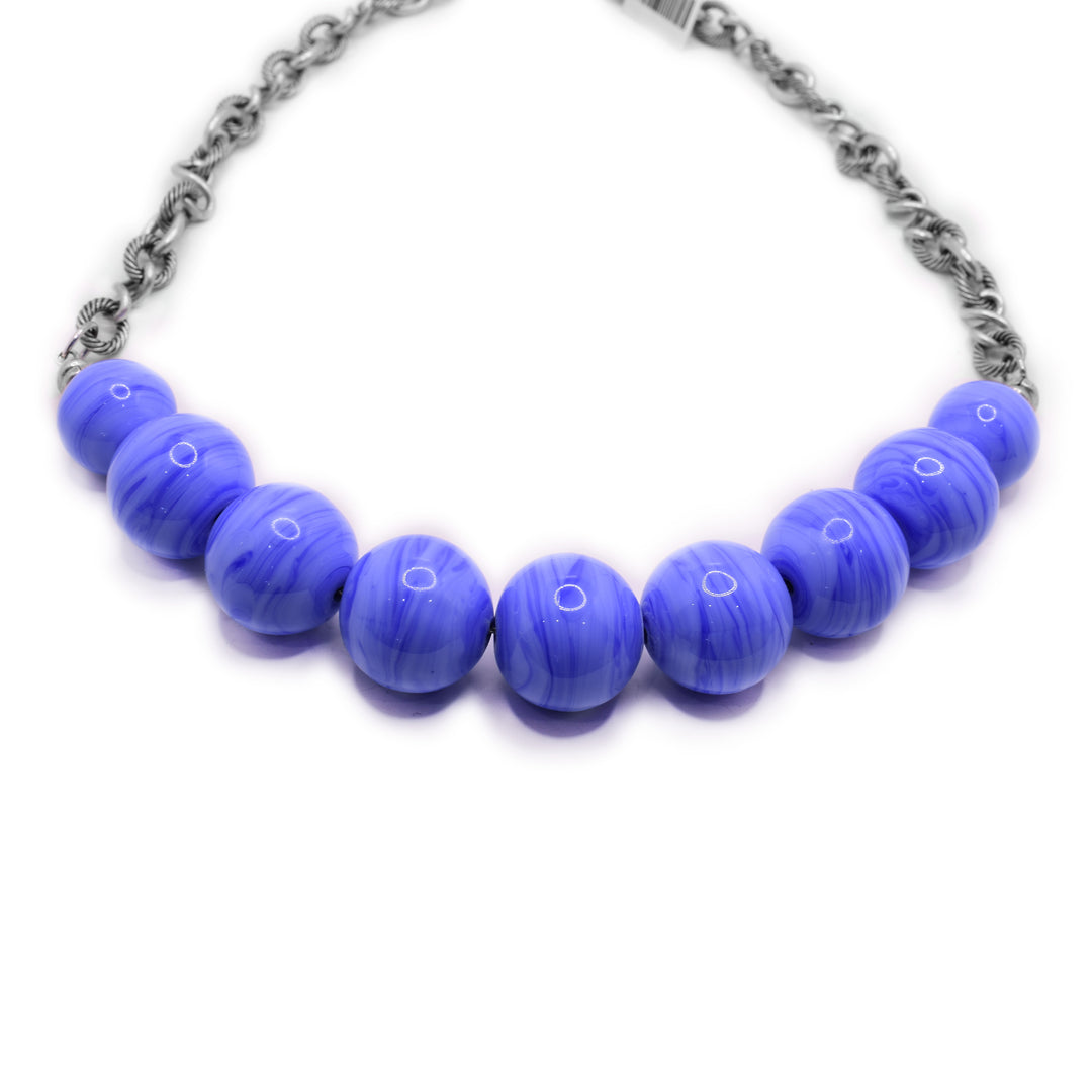 Chunky antiqued sterling silver chain with light and dark periwinkle handmade lampworked glass beads along front. By Wendy Pierson.