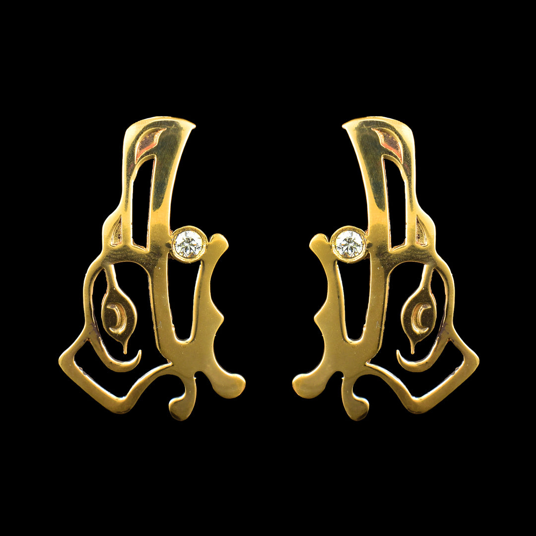 Elegant Raven drop earrings in polished brass with a diamond inlay. Hand-carved Raven face, Indigenous design meets modern luxury.