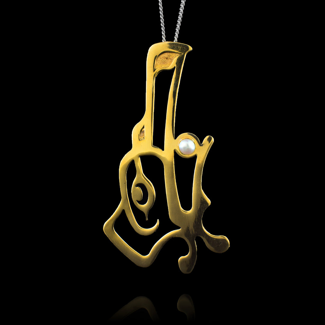 This large bronze pendant is handcrafted by Haida Gwaii artist Gina Mae Schubert. The piece features a detailed Raven design cast in bronze, accented with a pearl set in the Raven's mouth. The pendant is finished with a high polish to highlight the contrast between the metal and the gemstone.