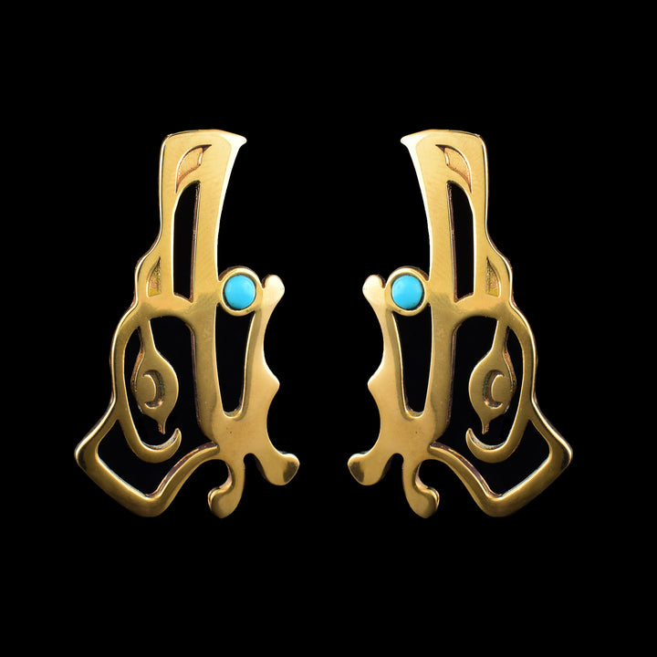 handcrafted bronze Raven drop earrings by Haida Gwaii artist Gina Mae Schubert. Featuring a vibrant turquoise accent, these unique pieces embody West Coast artistry.