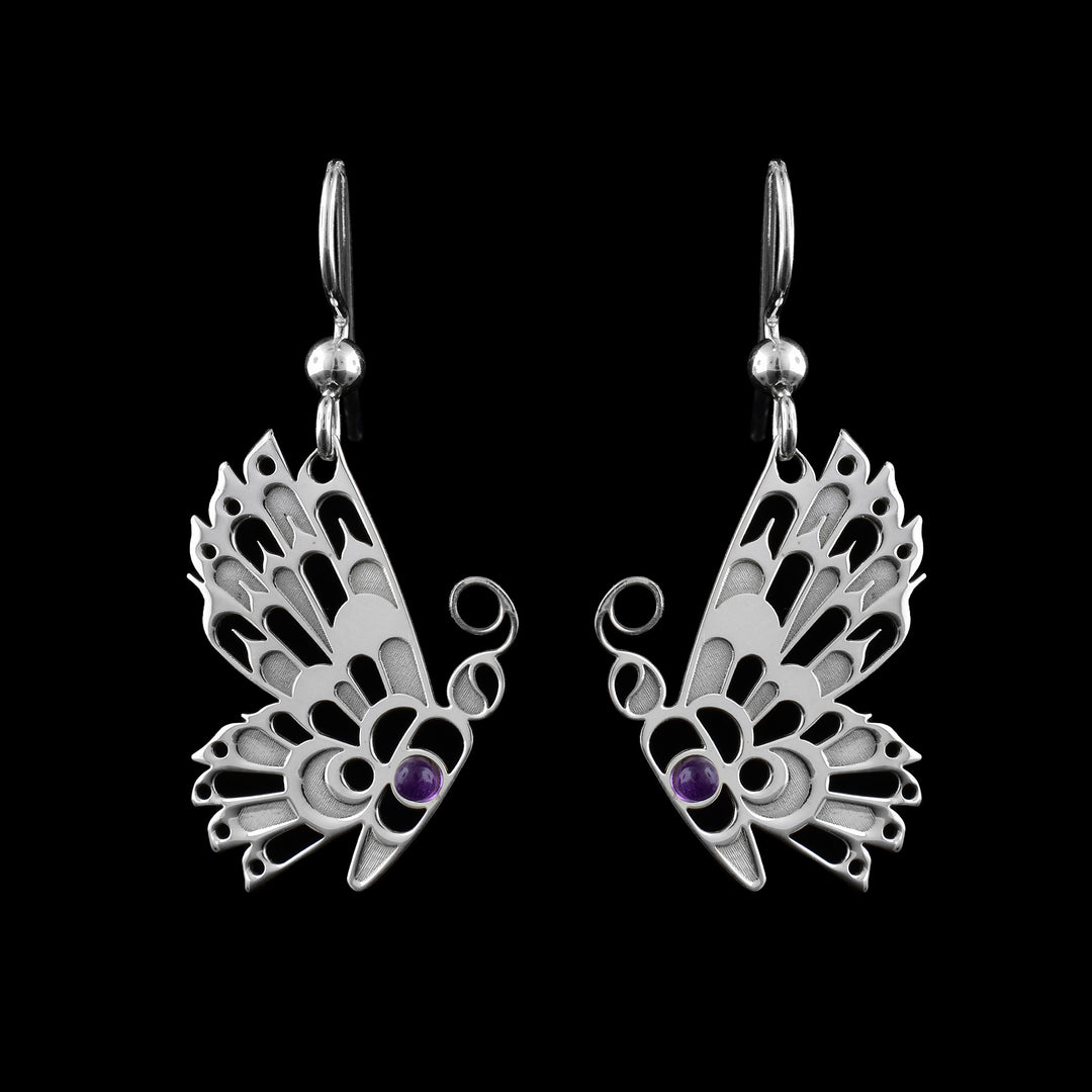 Sterling silver Butterfly earrings by Haida Gwaii artist Gina Mae Schubert. Hand-carved dangles featuring a striking Amethyst stone accent.