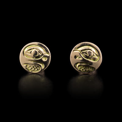 These rose gold stud earrings are circle shaped and are made from 14K rose/yellow gold. There is a depiction of the Eagle carved into the earrings.