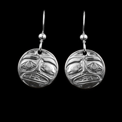 These moon dangle earrings have circle shaped hangs made from sterling silver. The face of the Moon legend is casted into the hangs. Its eyebrows, eyes, nose and mouth are detailed on the hangs.