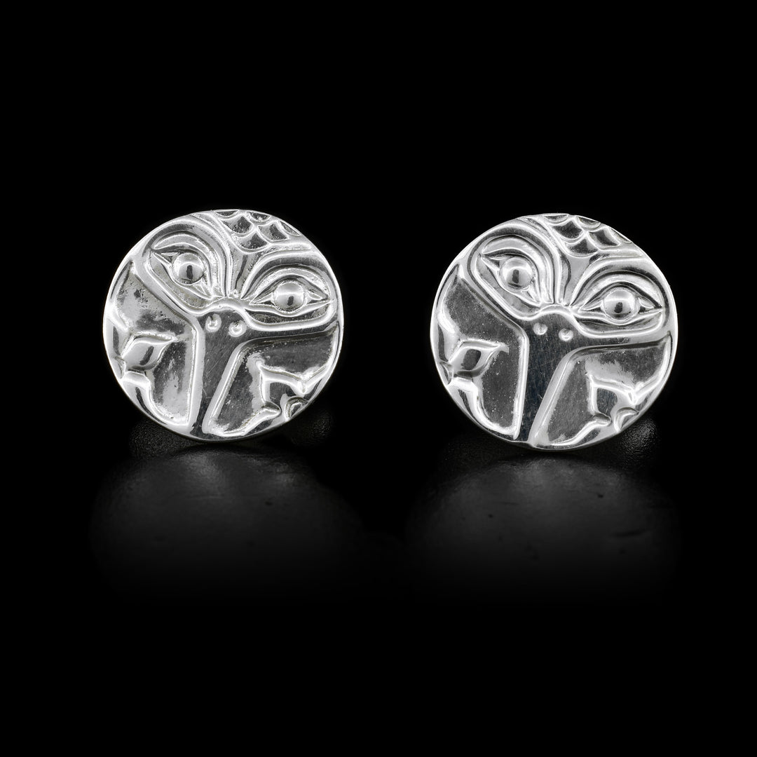 These sterling silver cufflinks are circle shaped and have a depiction of the Hummingbird on them.