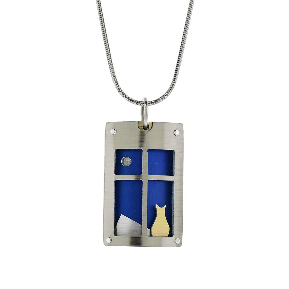This cat pendant necklace is made from brush and anodized aluminum with a stainless steel chain. The pendant depicts an anodized aluminum cat sitting in a window sill with a blue back ground.