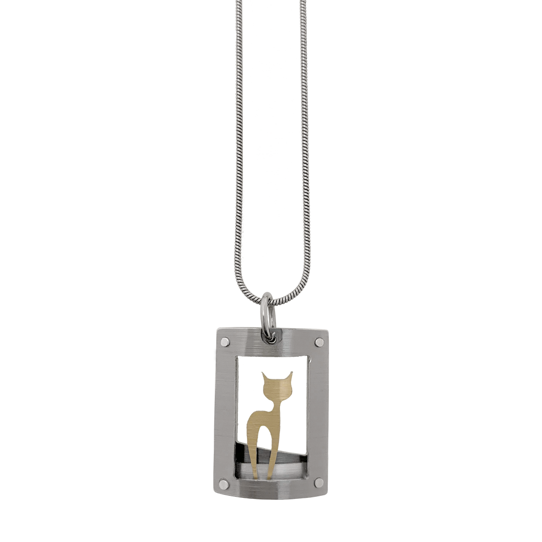 This cat necklace with pendant has a curved, grey frame with gold-colour cat silhouette inside. Side-view of cat with head turned to side so both ears are visible. Minimalist design. By JR Franco. Stainless steel snake chain included.