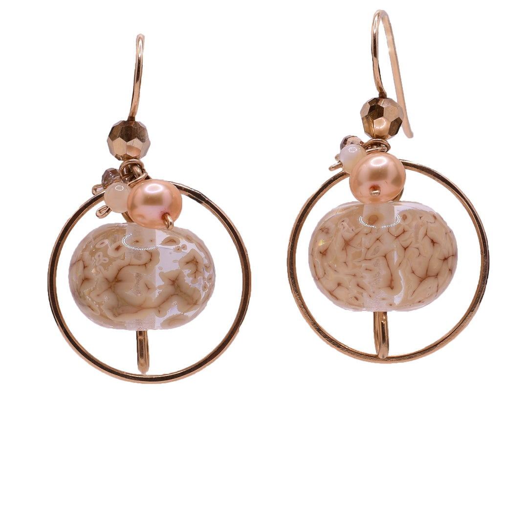 Dangle earrings made of  handworked brass, goldfilled wire, crystal pearls, and freshwater pearls. Titanium ear hooks. By Honica.