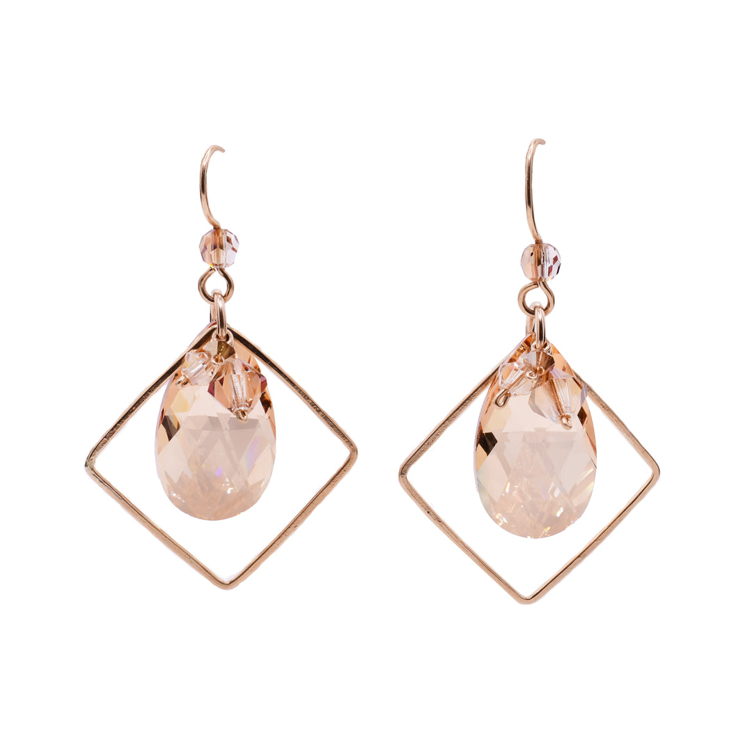 Dangle earrings made of Swarovski crystal and gold-filled wire. By Honica.