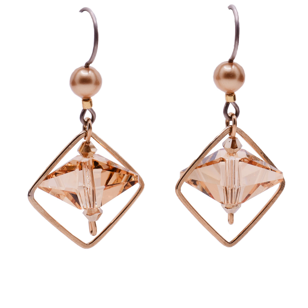Dangle earrings made of Swarovski crystal, crystal pearls and gold-filled wire. Titanium hooks. By Honica.