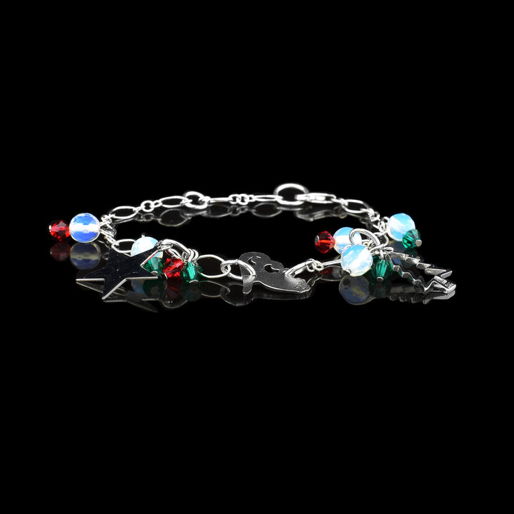 Christmas Charm Bracelet, with sleighs, stars and Christmas tree decorated with Christmas coloured beads around a sterling silver chain.