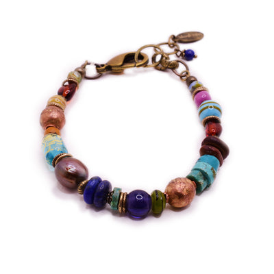 Beaded bracelet with lobster clasp and extension at back. Colourful beads include gemstones and glass beads. By Wendy Pierson.