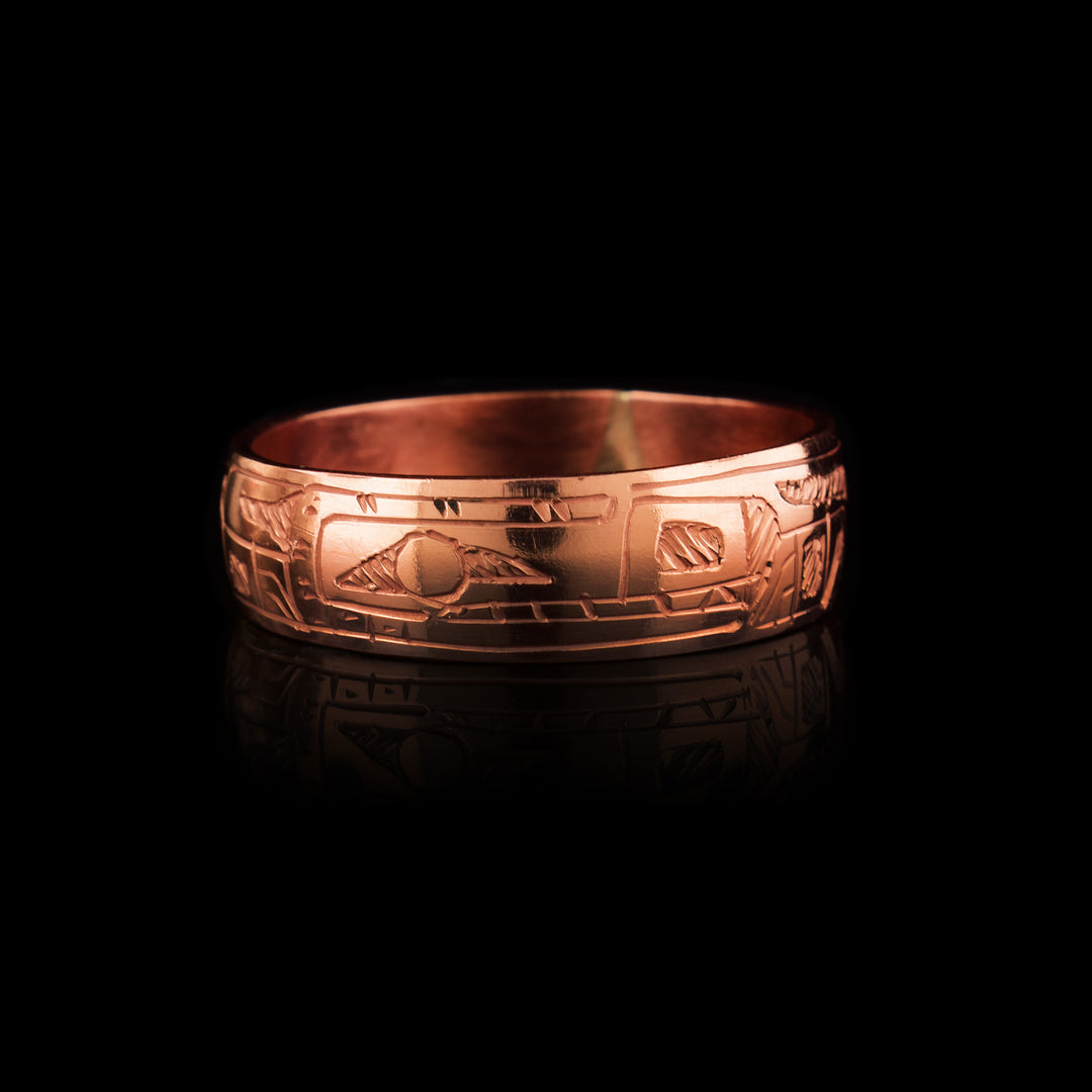 This quarter inch wide band ring made of copper has the indigenous legend of the Bear carved onto the surface. 