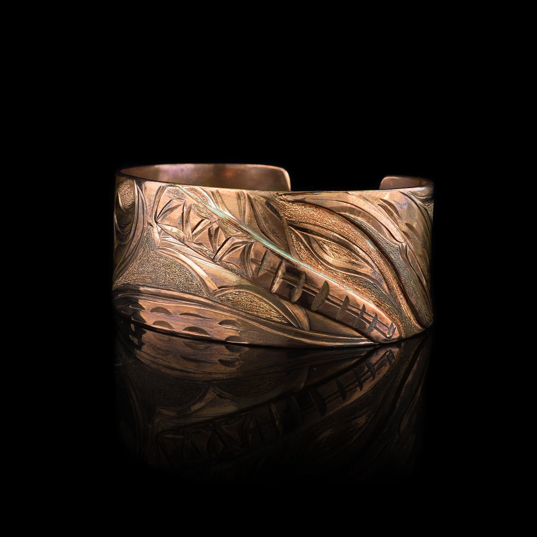 Discover the artistry of this hand-engraved Copper Bear Cuff Bracelet. statement jewelry, this bold statement piece blends traditional indigenous symbolism with a warm, radiant copper finish. Perfect for collectors of unique, artisan jewelry.