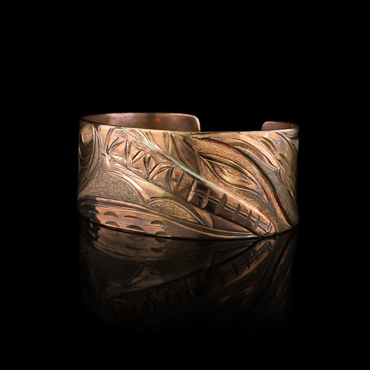 Discover the artistry of this hand-engraved Copper Bear Cuff Bracelet. statement jewelry, this bold statement piece blends traditional indigenous symbolism with a warm, radiant copper finish. Perfect for collectors of unique, artisan jewelry.