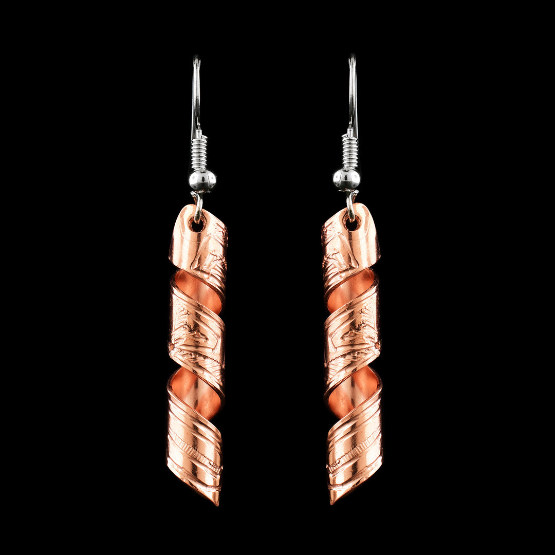 These spiral earrings have hangs made from copper bands that have been curved into horizontal spirals. The copper cylinders drop down and there are depictions of the Eagle carved into them with their beaks facing upwards.