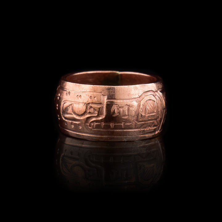 This Wolf spirit bead is made from copper and there is a depiction of the Wolf carved into its surface.