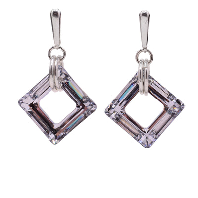 These Swarovski crystal earrings feature a square shaped cosmic grey Swarovski crystals with silver clips that incorporate silver loops.