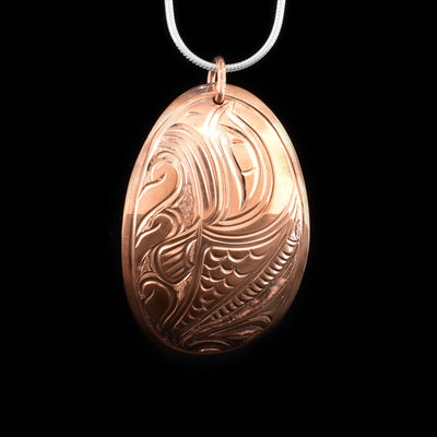 This copper Salmon fish pendant is oval shaped and has a depiction of the Salmon carved into it.