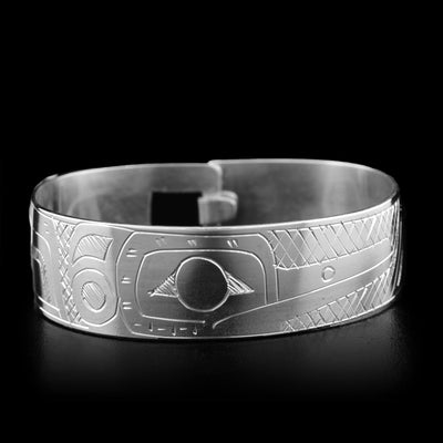 This sterling silver bracelet depicts the face of the Hummingbird. The body of the Hummingbird is around the rest of the bracelet. There is a clasp in the back.