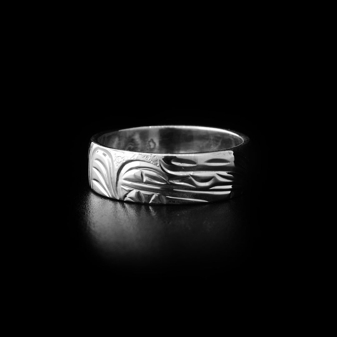 Sterling silver bear ring with hand-carved bear head and background designs. By Kwakwaka’wakw artist Cristiano Bruno.